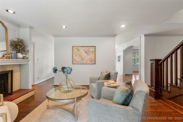 4146 S Birmingham Pl, Tulsa, OK 74105 - living area with wood finished floors, stairs, a fireplace, recessed lighting, and crown molding