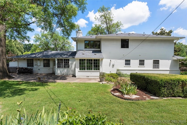 4146 S Birmingham Pl, Tulsa, OK 74105 - back of property with a chimney, a patio area, and a lawn