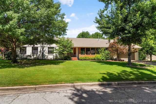 3918 S Evanston Ave, Tulsa, OK 74105 - single story home with an attached garage, a front lawn, and driveway