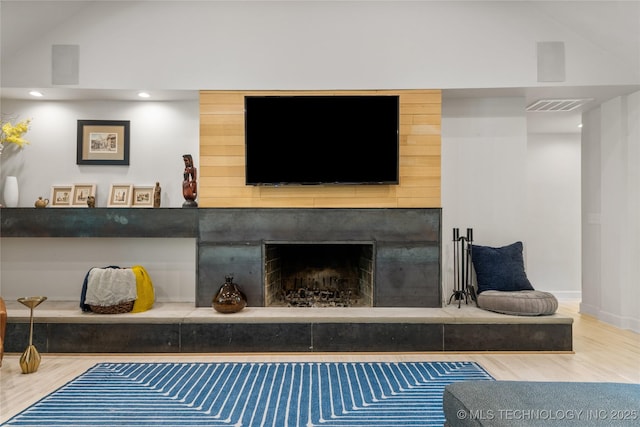 3918 S Evanston Ave, Tulsa, OK 74105 - detailed view of wood finished floors, a large fireplace, and recessed lighting