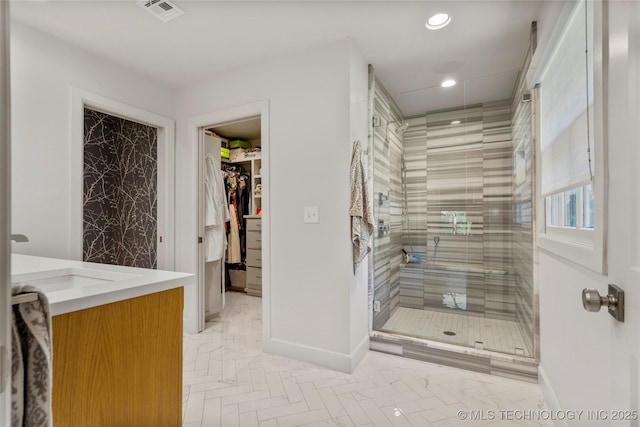 3918 S Evanston Ave, Tulsa, OK 74105 - full bath featuring vanity, a shower stall, recessed lighting, and a walk in closet