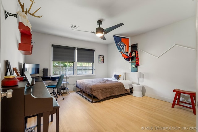 3918 S Evanston Ave, Tulsa, OK 74105 - bedroom with wood finished floors, an office area, and a ceiling fan