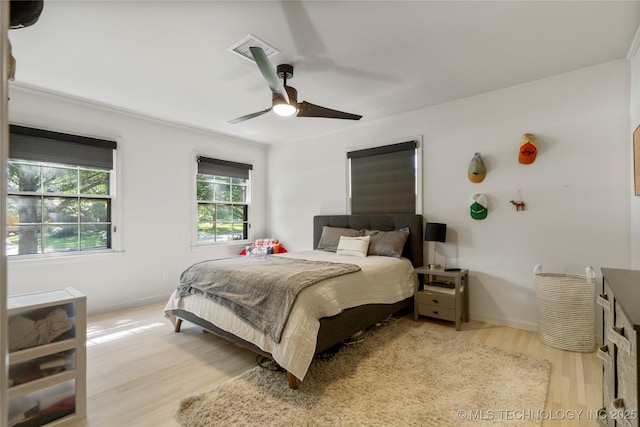 3918 S Evanston Ave, Tulsa, OK 74105 - bedroom with light wood-style floors and a ceiling fan