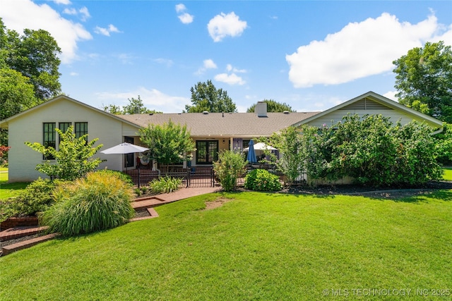 3918 S Evanston Ave, Tulsa, OK 74105 - rear view of property with a patio, french doors, and a lawn