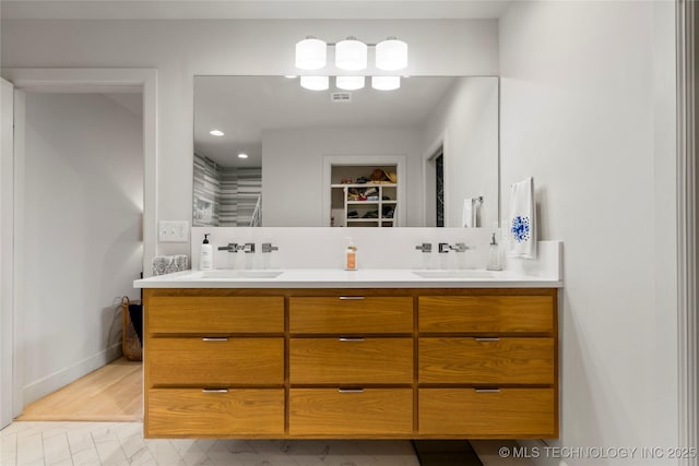 3918 S Evanston Ave, Tulsa, OK 74105 - full bathroom with double vanity, a spacious closet, and recessed lighting