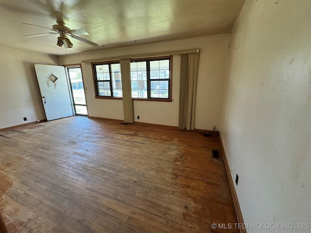 611 Crutchmer Ave, Okmulgee, OK 74447 - spare room featuring hardwood / wood-style flooring and a ceiling fan