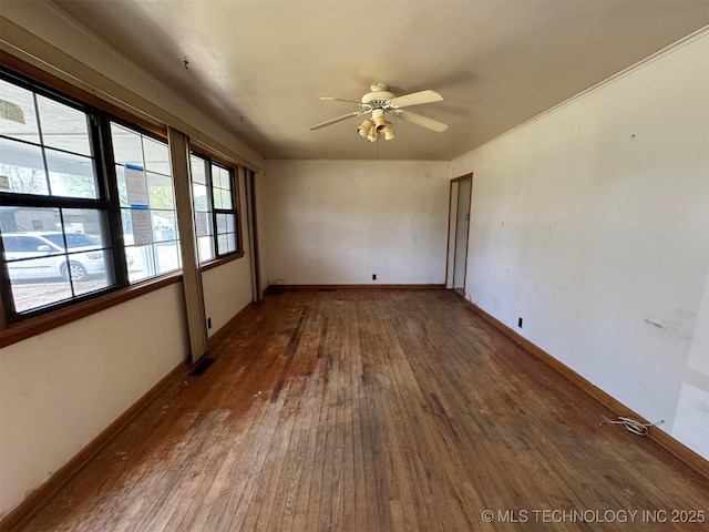 611 Crutchmer Ave, Okmulgee, OK 74447 - spare room with wood finished floors and ceiling fan