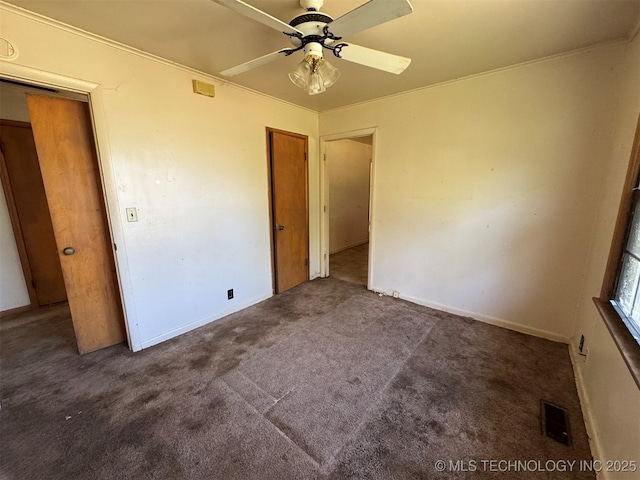 611 Crutchmer Ave, Okmulgee, OK 74447 - unfurnished bedroom with carpet flooring, ceiling fan, and ornamental molding