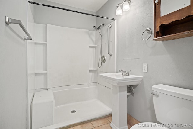 345 N Pine, Dewey, OK 74029 - bathroom with toilet and tile patterned floors