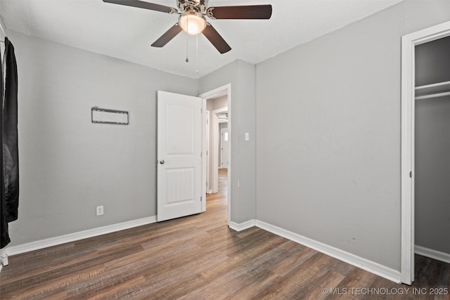 345 N Pine, Dewey, OK 74029 - unfurnished bedroom with wood finished floors and ceiling fan