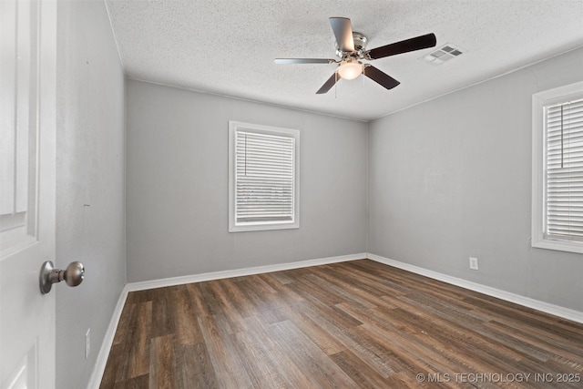 345 N Pine, Dewey, OK 74029 - empty room featuring wood finished floors, a textured ceiling, and ceiling fan