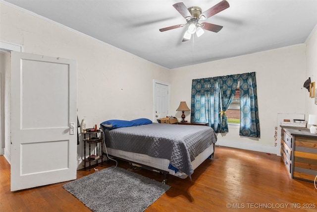 817 S Stockton, Ada, OK 74820 - bedroom with crown molding, wood finished floors, and ceiling fan