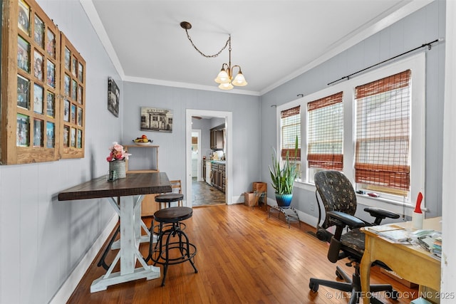 817 S Stockton, Ada, OK 74820 - office space with crown molding, wood-type flooring, and a chandelier