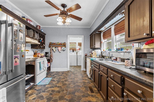 817 S Stockton, Ada, OK 74820 - kitchen featuring stainless steel appliances, independent washer and dryer, a ceiling fan, dark stone finish flooring, and dark countertops