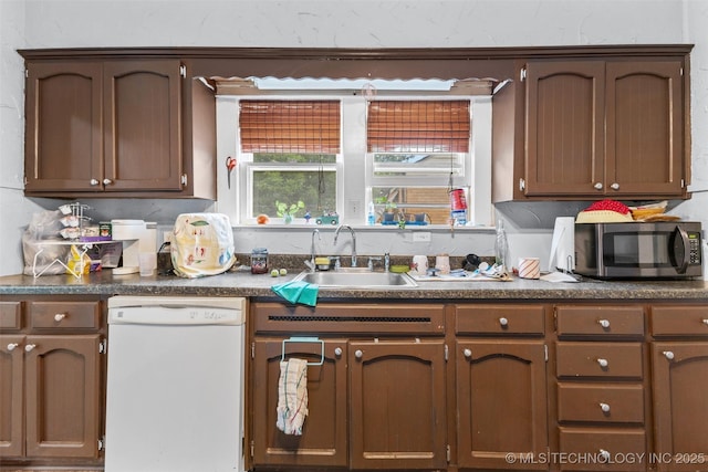 817 S Stockton, Ada, OK 74820 - kitchen with dishwasher, stainless steel microwave, and dark countertops