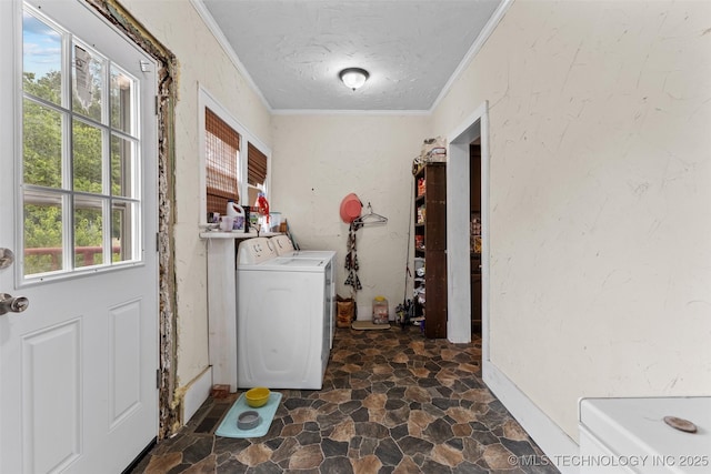 817 S Stockton, Ada, OK 74820 - laundry area featuring washer / clothes dryer, ornamental molding, stone finish flooring, and a textured ceiling