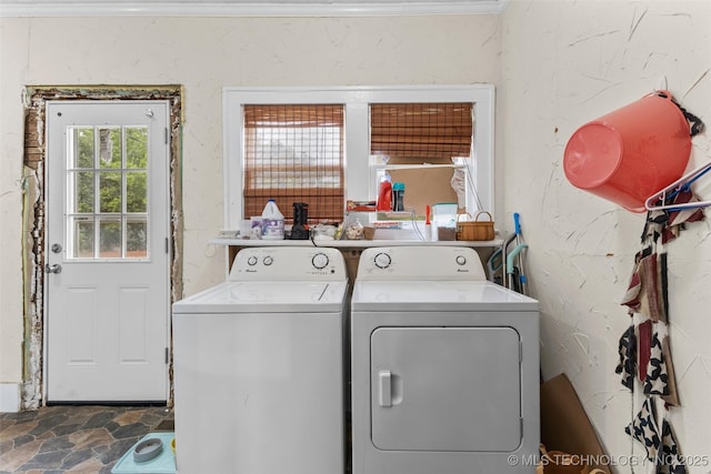 817 S Stockton, Ada, OK 74820 - laundry area featuring washer and clothes dryer and stone finish floors