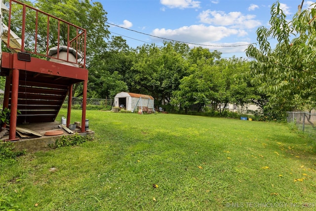 817 S Stockton, Ada, OK 74820 - fenced backyard with a storage unit and a deck