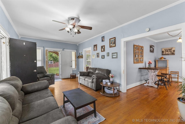 817 S Stockton, Ada, OK 74820 - living room featuring a ceiling fan, wood finished floors, and crown molding