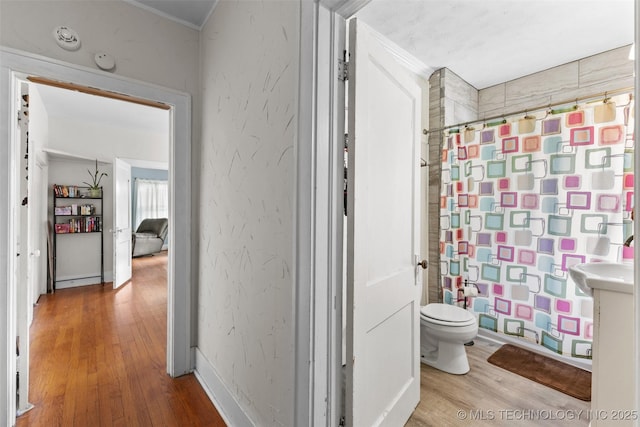 817 S Stockton, Ada, OK 74820 - full bathroom with wood finished floors, a shower with shower curtain, and ornamental molding