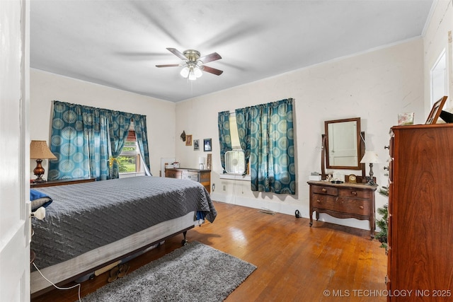 817 S Stockton, Ada, OK 74820 - bedroom with wood finished floors and a ceiling fan