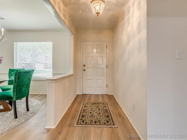 5610 S 75th E Pl, Tulsa, OK 74145 - entrance foyer featuring a chandelier, light wood finished floors, and ornamental molding