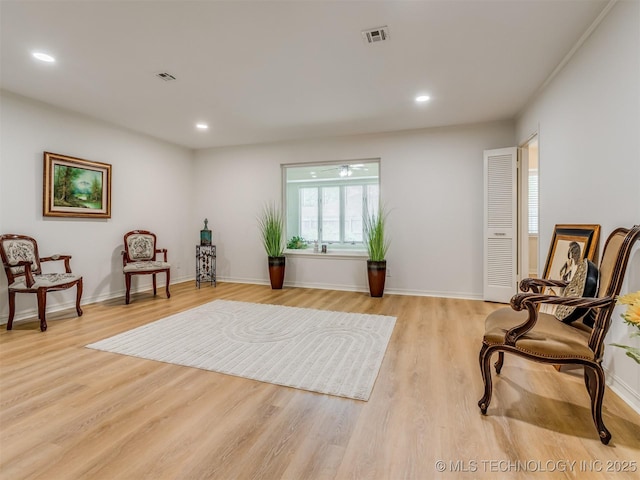 5610 S 75th E Pl, Tulsa, OK 74145 - sitting room with light wood finished floors and recessed lighting