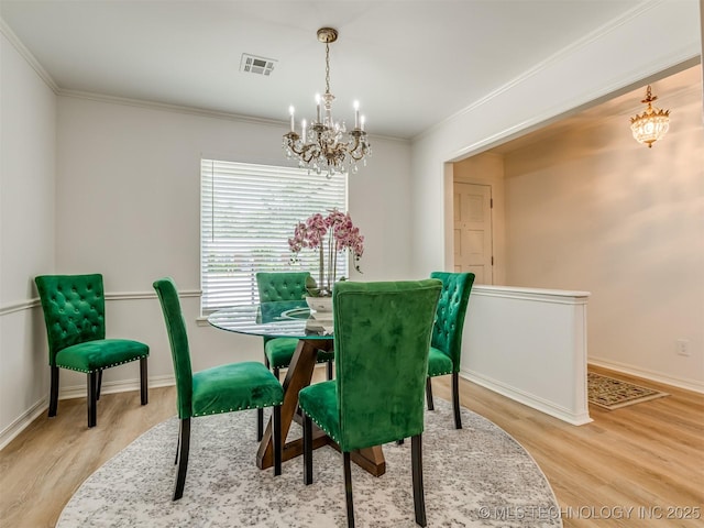 5610 S 75th E Pl, Tulsa, OK 74145 - dining room with a chandelier, wood finished floors, and crown molding