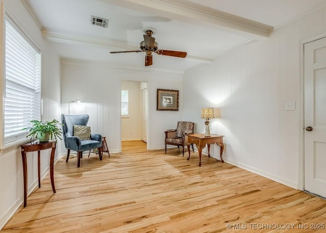 5610 S 75th E Pl, Tulsa, OK 74145 - living area featuring light wood-style floors, ceiling fan, beam ceiling, and ornamental molding