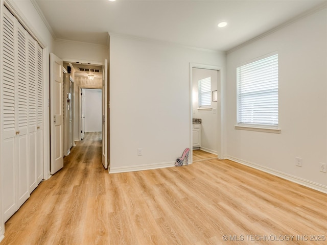 5610 S 75th E Pl, Tulsa, OK 74145 - unfurnished bedroom with light wood finished floors, ornamental molding, recessed lighting, ensuite bathroom, and a closet