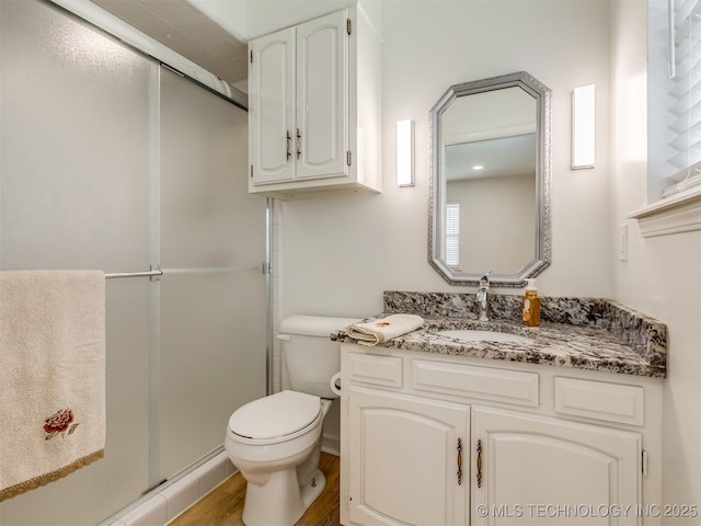 5610 S 75th E Pl, Tulsa, OK 74145 - bathroom with a stall shower, vanity, and wood finished floors