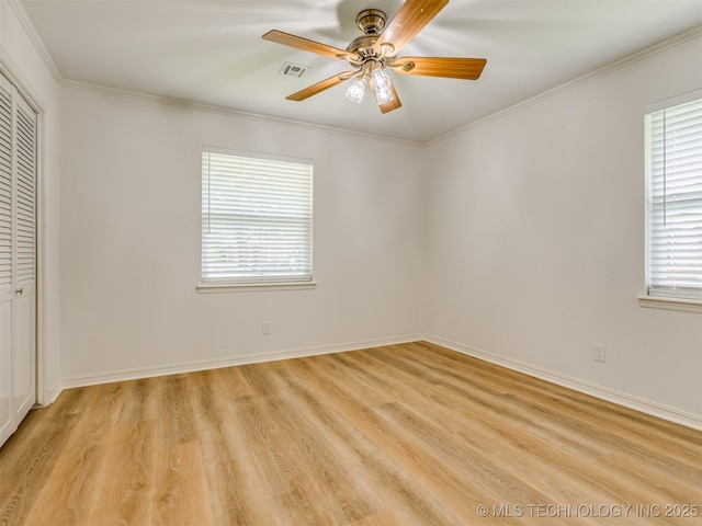 5610 S 75th E Pl, Tulsa, OK 74145 - unfurnished bedroom featuring light wood-style floors, a closet, ornamental molding, and ceiling fan
