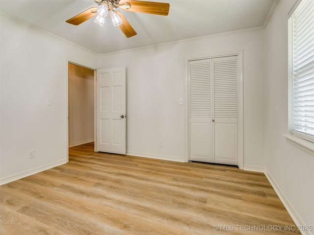 5610 S 75th E Pl, Tulsa, OK 74145 - unfurnished bedroom with light wood finished floors, a closet, crown molding, and a ceiling fan