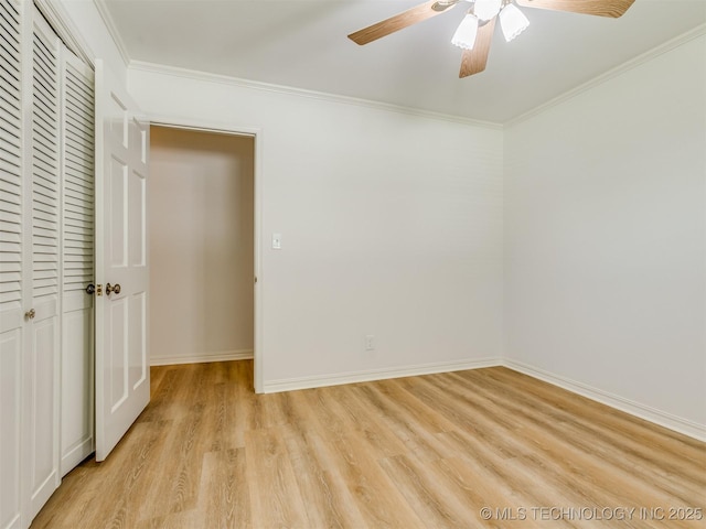 5610 S 75th E Pl, Tulsa, OK 74145 - unfurnished bedroom with light wood finished floors, ornamental molding, ceiling fan, and a closet