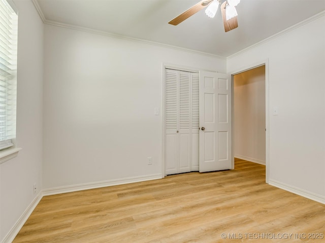 5610 S 75th E Pl, Tulsa, OK 74145 - unfurnished bedroom featuring light wood-style flooring, ornamental molding, ceiling fan, and a closet