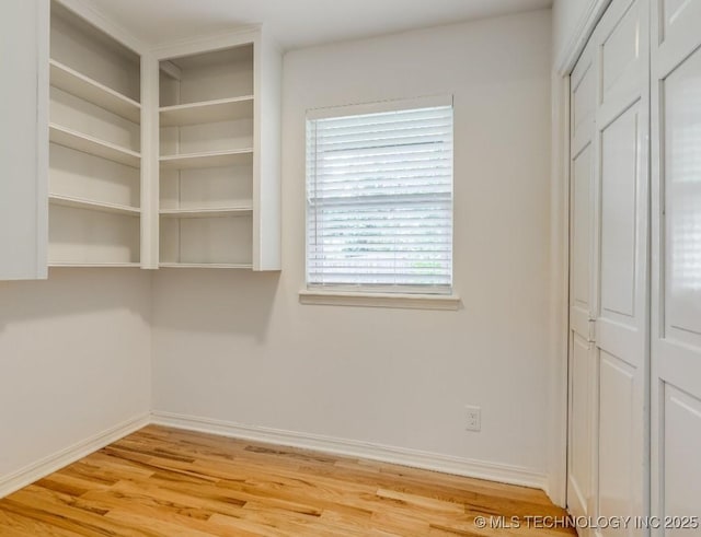 5610 S 75th E Pl, Tulsa, OK 74145 - unfurnished bedroom featuring light wood finished floors and a closet