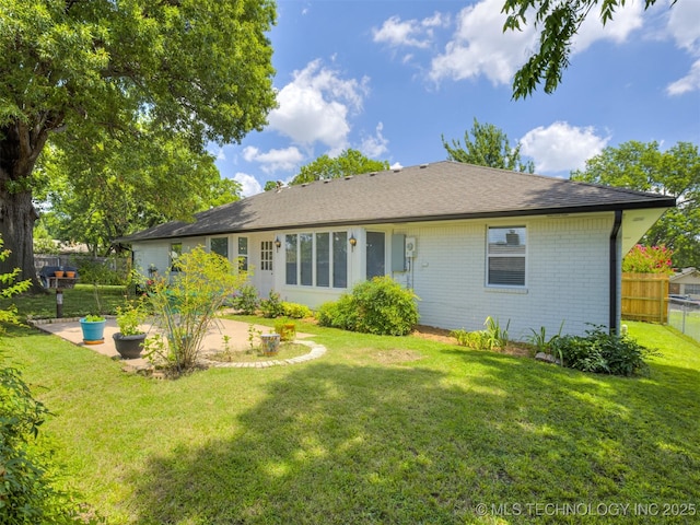 5610 S 75th E Pl, Tulsa, OK 74145 - back of house featuring brick siding and a patio area