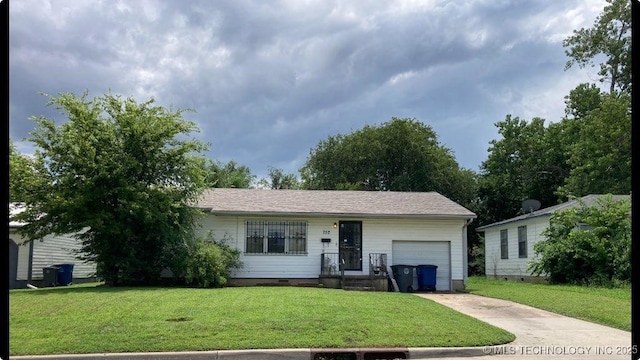 752 E 35th St N, Tulsa, OK 74106 - single story home with a garage, concrete driveway, and a front yard