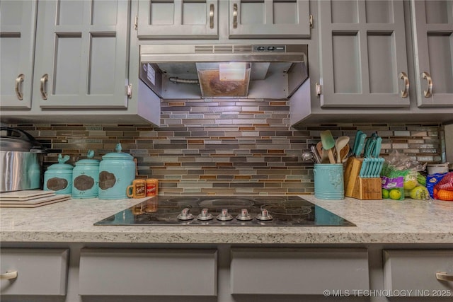 920 Ridge Oak Rd, Sapulpa, OK 74066 - kitchen featuring ventilation hood, black electric cooktop, and tasteful backsplash