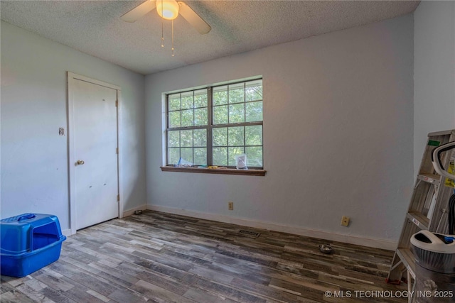 920 Ridge Oak Rd, Sapulpa, OK 74066 - unfurnished bedroom with wood finished floors, a textured ceiling, and a ceiling fan