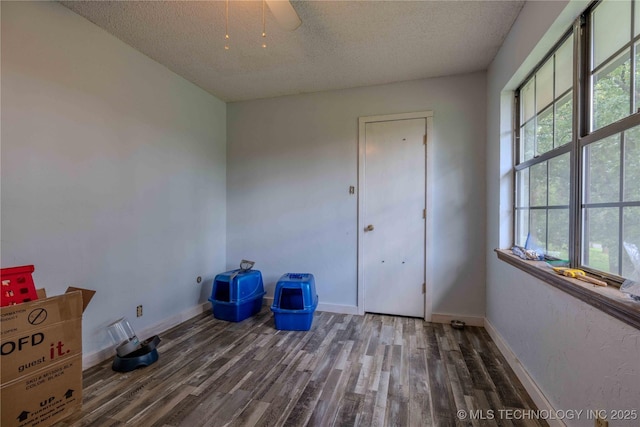 920 Ridge Oak Rd, Sapulpa, OK 74066 - unfurnished bedroom with wood finished floors and a textured ceiling