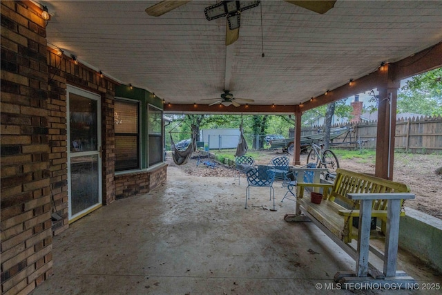 920 Ridge Oak Rd, Sapulpa, OK 74066 - fenced backyard featuring a patio, ceiling fan, and outdoor dining area