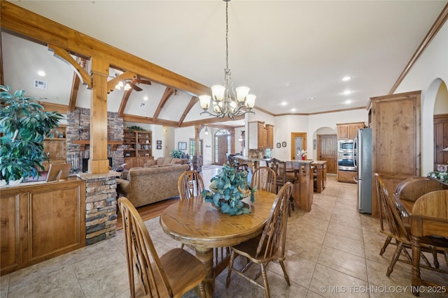 7355 E 453rd Rd, Claremore, OK 74017 - dining area featuring arched walkways, light tile patterned floors, a chandelier, vaulted ceiling, and recessed lighting