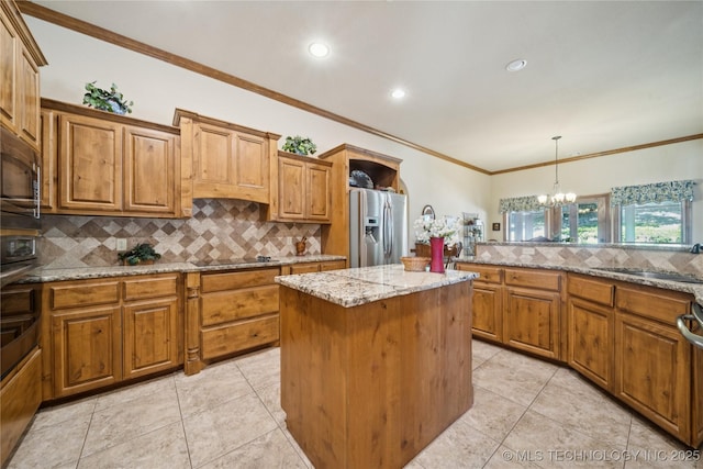 7355 E 453rd Rd, Claremore, OK 74017 - kitchen featuring stainless steel appliances, decorative backsplash, a chandelier, a kitchen island, and brown cabinets