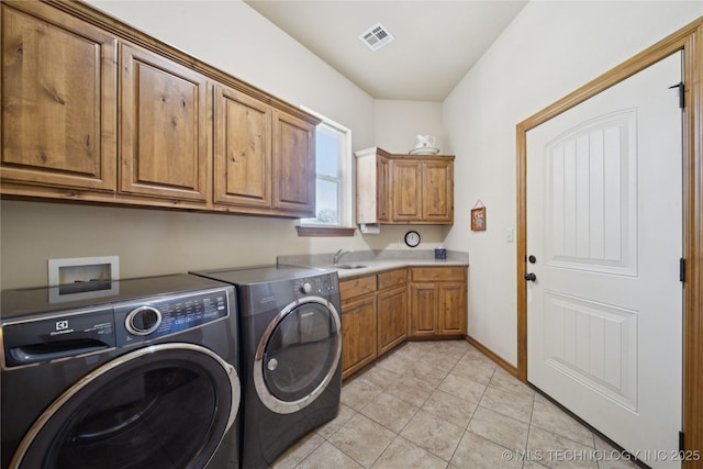 7355 E 453rd Rd, Claremore, OK 74017 - laundry room with independent washer and dryer, cabinet space, and light tile patterned floors