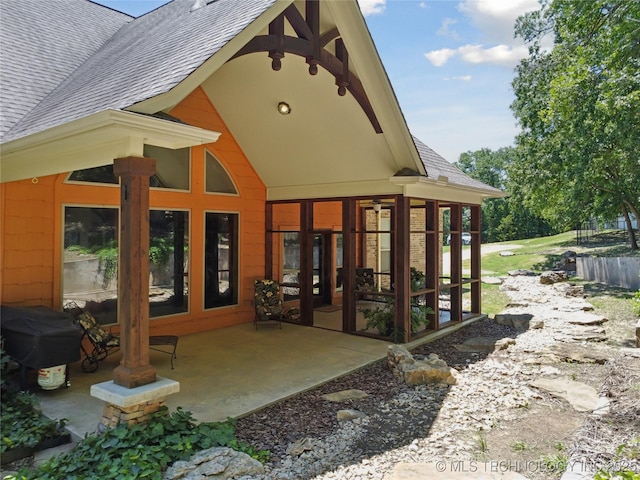 7355 E 453rd Rd, Claremore, OK 74017 - back of property featuring a shingled roof, french doors, and a patio area