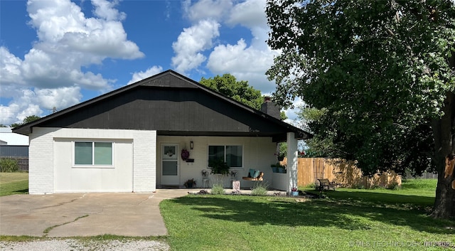 116 S Shawnee Ave, Dewey, OK 74029 - view of front of house with a chimney and concrete driveway
