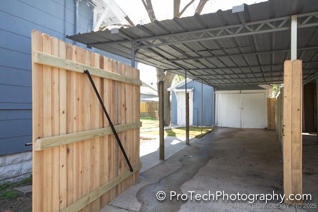2216 E 8th St, Tulsa, OK 74104 - view of parking / parking lot with a storage shed