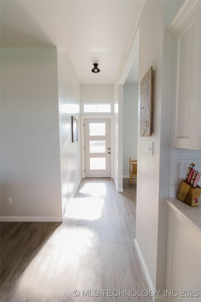 11940 County Road 3513, Ada, OK 74820 - corridor featuring light wood-style flooring and baseboards