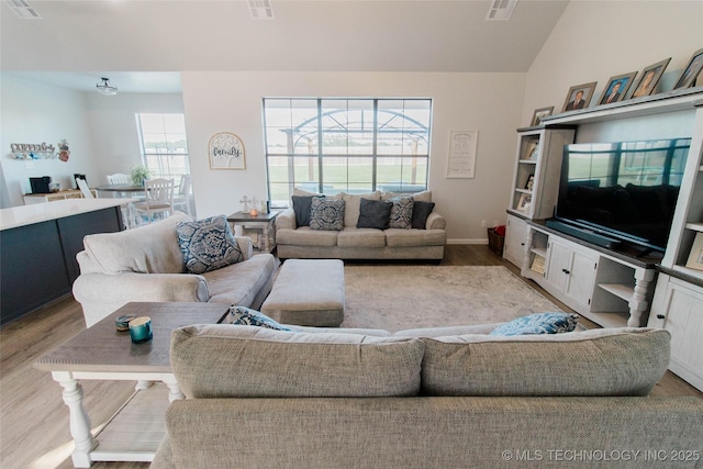 11940 County Road 3513, Ada, OK 74820 - living area featuring wood finished floors and lofted ceiling